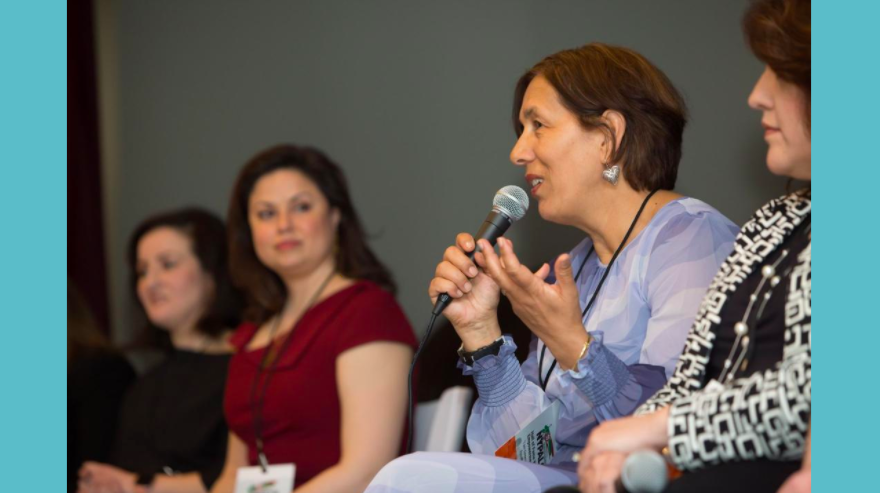 women speaking at event picture